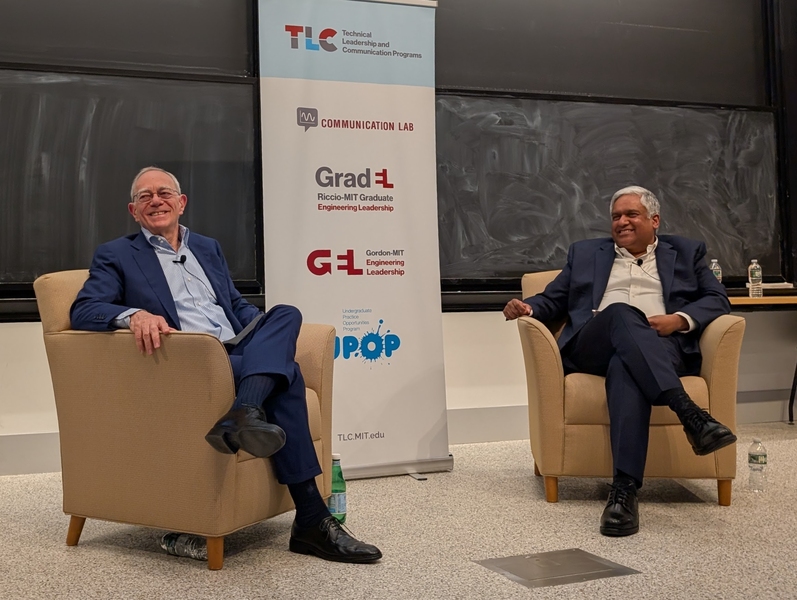 L. Rafael Reif and Anantha Chandrakasan sitting in easy chairs and smiling